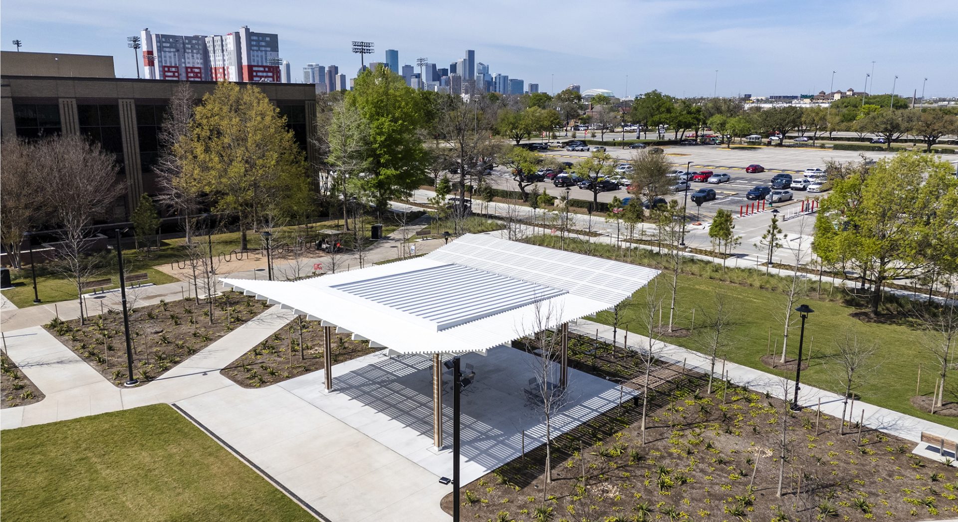 The new water feature and native plants surrounding the covered amphitheater stage at the University of Houston's Wilhelmina's Grove.
