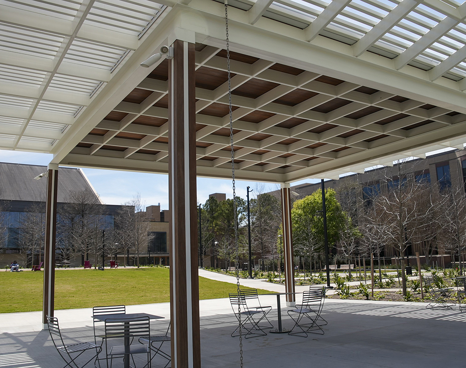 Close-up of Houston custom woodwork on the Wilhelmina's Grove pavilion, showing precision-cut Ipe wood columns attached to interior steel with monarch clips.