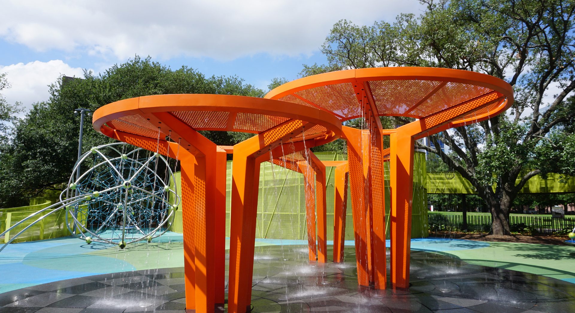 Renfrow+Co's custom-designed orange metal water feature installed at Levy Park