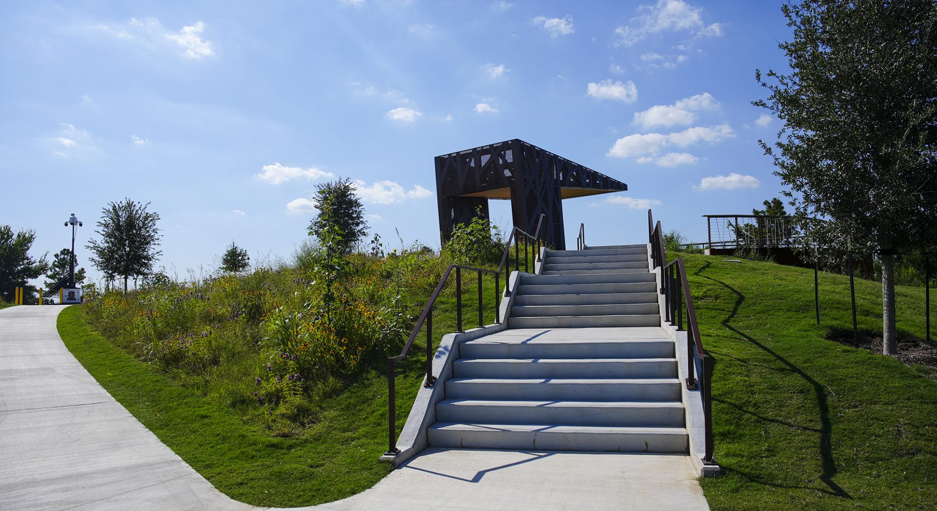 Distant shot of custom fabricated pavilion at Hill at Sims Park