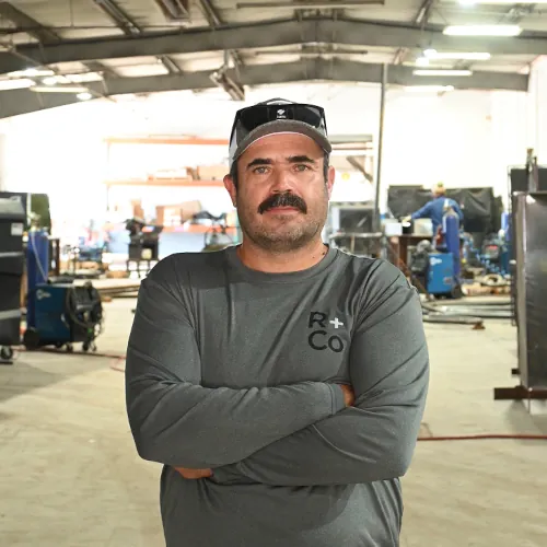 Portrait of Luis Ramirez, Field Manager at Renfrow+Co, overseeing on-site operations for custom metal and woodwork projects in Houston